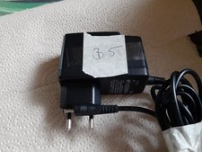 Steckernetzteil , Netzteil , Ladegerät - 6,8 V =  ,  700 mA - Hohlst.-ungeregelt