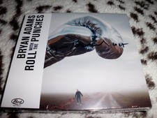 BRYAN ADAMS - ROLL WITH THE