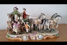 Porzellankutsche mit drei