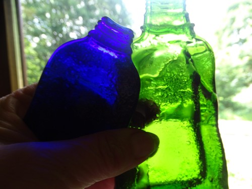 Geschmolzene glas flasche - geschmolzene,