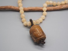 Unisex lange gelbe Calcit Kugelkette geknotet mit geschnitztem Buddha Anhänger
