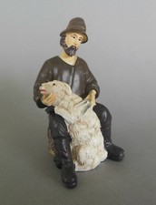 Hirte Schafscherer sitzend mit