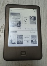 eBook Reader Tolino shine mit Schutzhülle und einigen Büchern