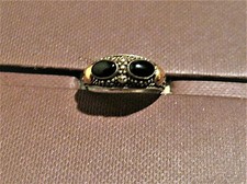 Ring,925er Silber mit teilw. 18 Kt. Goldauflage.Edelstein: 2 Onyxe oder 2  Achat