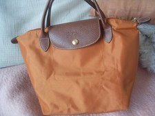 Handtache, Longchamp, le