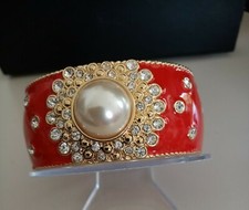 Armspange rot mit - , und