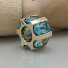 Anhänger Läufer mit Blautopas Besatz in 375/9K Gelbgold