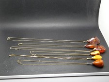 6 alte vergoldete Ketten mit jeweils einem Anhänger Bernstein