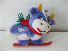 lila Milka Kuh auf Ski unbespielte Werbefigur Plüsch Werbung Reklame Süßwaren