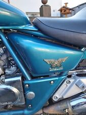 Daelim VT 125 F   Seitendeckel links grün Abdeckung li Deckel Sitzbank 4/2