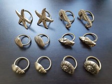 12 alte Serviettenringe, aus Metall, u.a. Muschel, Seepferchen, Seestern