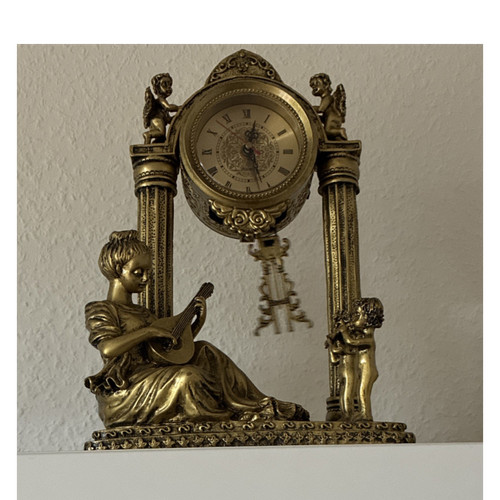 Antike goldene kaminuhr aus - antike,