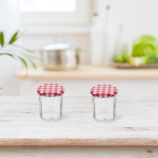  4 leere Marmeladengläser mit