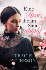 Eine Rose, die im Sand
