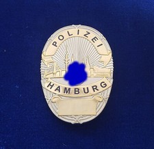 ehemalige Polizeimarke Hamburg (Wappen gepixelt)