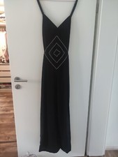 Schwarzes Hosenkleid mit Pailetten