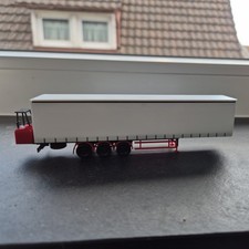 Herpa  Gardinenplanen-Auflieger in Weiß/Schwarz/ Rot mit Mitnahme-Stapler 