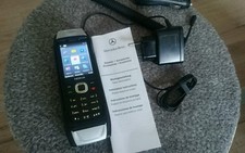 Nokia  Classic 6700 - Schwarz+ Aufnahmeschale für Mercedes 