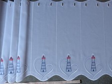 Scheibengardine mit Leuchtturm