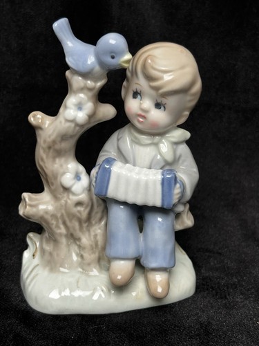 Porzellanfigur junge mit - ,
