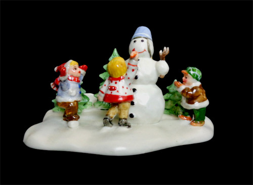 Kinder bauen schneemann - bauen,