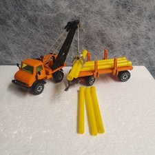 siku 2820- Unimog U 406 Rohrverleger mit Kran und 8 Rohre-1:55 - 70 iger  Jahre