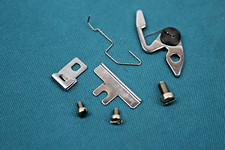 Fadenanzugsfeder + Führungen