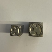 2 Logos KONSUM aus DDR Bleischrott, Altblei, Bleibuchstaben aus Druckerei