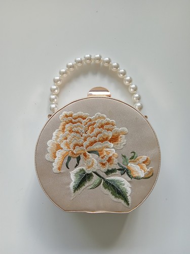 Handtasche goldbestickt
