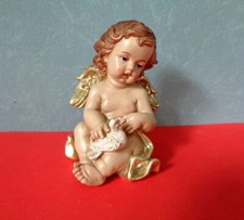 Amorengel sitzend Engel mit