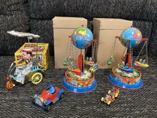 5x altes Blechspielzeug ( Autos + Karussell + Rikschafahrer ) teilweise in OVP