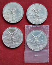 4 Silbermünzen je 1 Unze