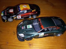 2 mal Aston Martin auf Carrera Universal Schleifer umgebaut