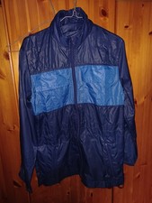 Puma  Glanznylon - Regenjacke aus den 80er / 90er Jahren mit Tragespuren