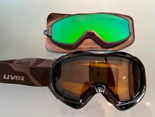 Skibrille Uvex mit Sonnenclip und ggf. weißer Giro-Skihelm in L