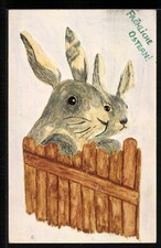 Künstler-AK Handgemalt: Osterhasen schauen über einen Zaun 1933 