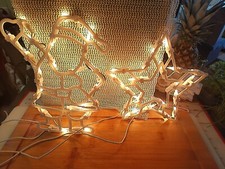 Beleuchteter Weihnachtsmann und Stern