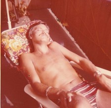 Photo Young Man in Swim Trunks