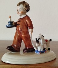 Porzellanfigur, Junge mit Kerze und Spielzeug, Höhe ca. 11 cm