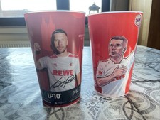 2x Lukas Podolski Stadionbecher 1. FC Köln UNSERE 10 KEHRT HEIM & Standard