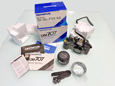 Olympus OM707 "Power Flash Grip 300" Spiegelreflexkamera (inkl. Zoom-Objektiv)