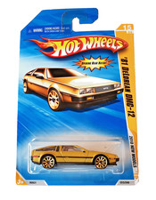 ✅  Hot Wheels '81 DeLorean DMC-12 in OVP * 2010 New Models * Satin Gold * MOC