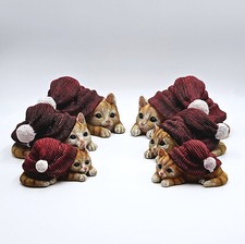 Gilde Katze mit Mütze liegend