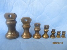 7 antike Englische Glockengewichte aus Messing / Bronze