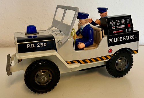 Vintager polizeijeep aus blech - aus,