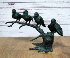 Bronzefigur vier Vögel auf