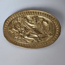 Brass relief erotic scene