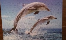 Puzzles 99 Teile für Kinder 30x22cm Motiv Delphine gebraucht bespielt