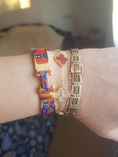 Hermes Armreif Clic H mit bedrucktem Email rot orange