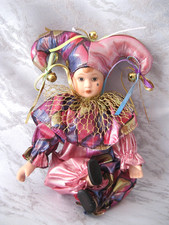 Harlekin sitzend Porzellan